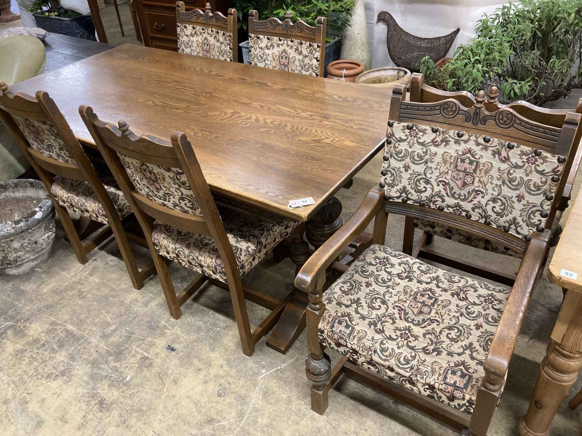 A rectangular 18th century style oak refectory dining table, length 182cm, depth 91cm, height 78cm, together with six matching dining chairs (two with arms)